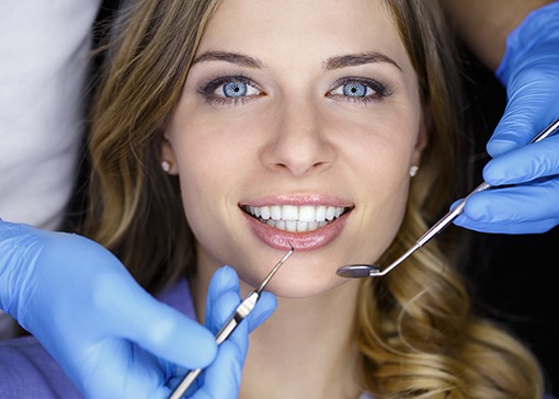 Woman receiving cosmetic dentistry evaluation
