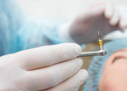 A person undergoing dental implant surgery