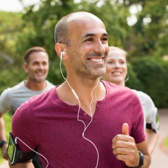 Man with healthy smile on a run