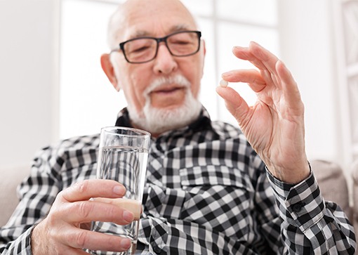 Man holding oral conscious dental sedation pill