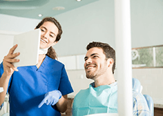 a patient learning about the cost of veneers