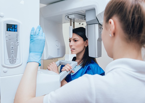 Woman receiving 3 D C T cone beam digital x-ray scans