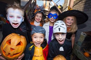 A group of kids dressed in costumes.