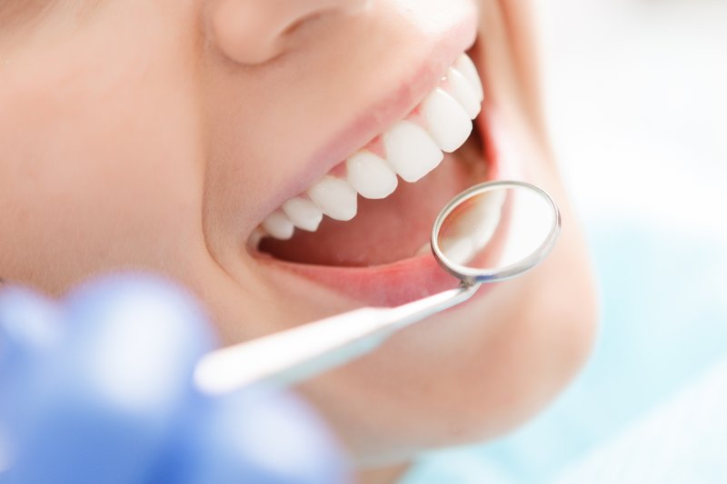 patient talking to their dentist