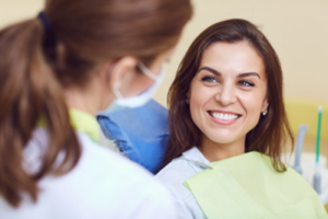 Patient smiling at her dentist