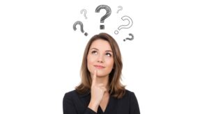 Woman touching her chin, wearing curious expression